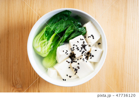 Tofu soup on wooden background 47736120