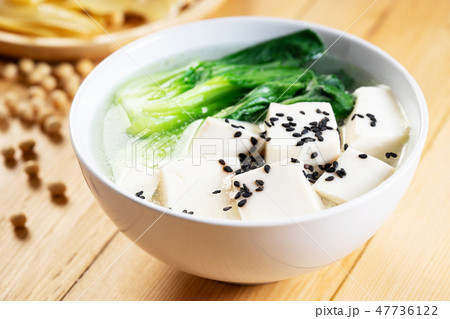 Tofu soup on wooden background Tofu soup on wooden background 47736122