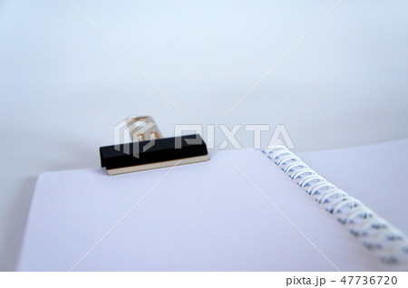Black color bulldog clip clipping small book 47736720