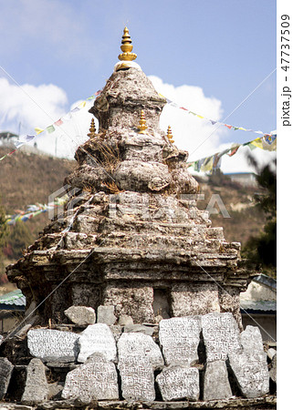 Buddhism stupa or chorten with prayer flags  47737509