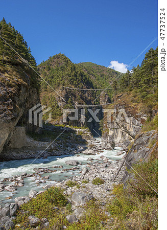 Suspension bridge on the way to Namche Bazar Suspension bridge on the way to Namche Bazar 47737524