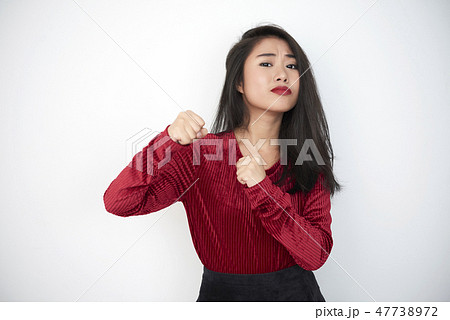Woman protecting herself Woman protecting herself 47738972