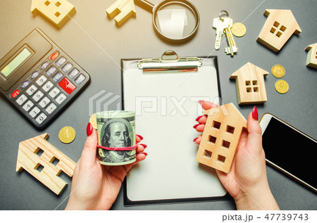 A girl holds in his hands a dollars  47739743