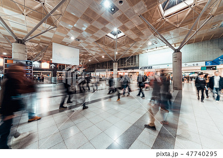 Motion blur of people walking in exhibition hall Motion blur of people walking in exhibition hall 47740295