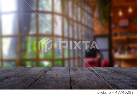 Empty wooden table in blur restaurant background 47740298