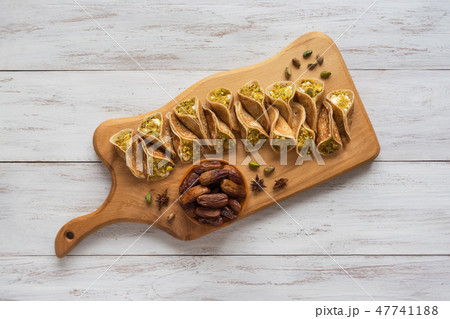 Traditional Arabic crepes stuffed with cream Traditional Arabic crepes stuffed with cream 47741188