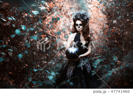 Woman in Halloween costume. Woman in Halloween costume. 47741460
