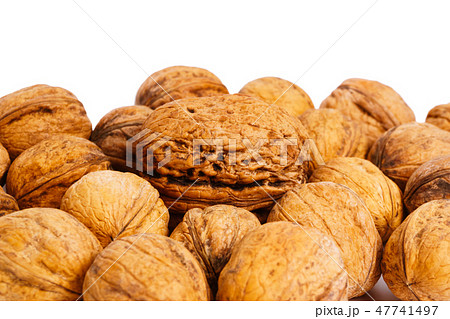 heap of walnuts isolated on a white background heap of walnuts isolated on a white background 47741497