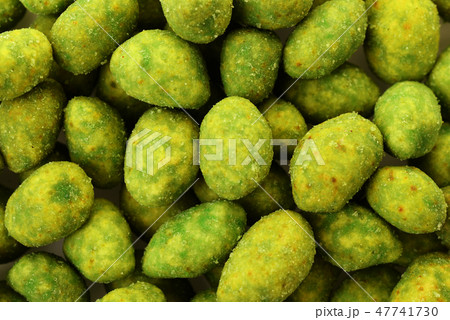 Peanuts in green mustard breaded as background 47741730