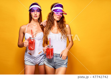 Stylish ladies with drinks Stylish ladies with drinks 47742742