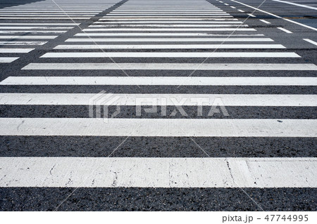 Crosswalk pedestrian crossing in the street 47744995