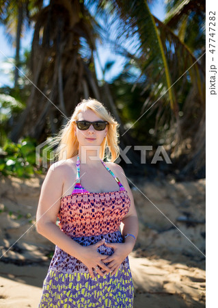 Young sexy blonde woman in dress near sea 47747282