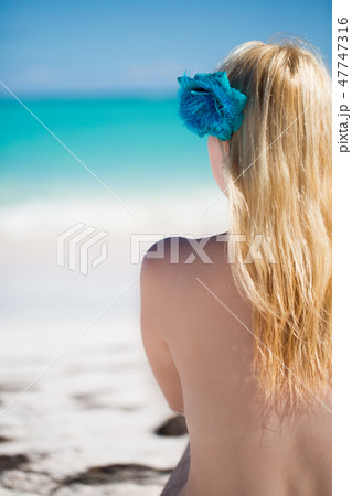Young sexy blonde woman in bikini near sea 47747316