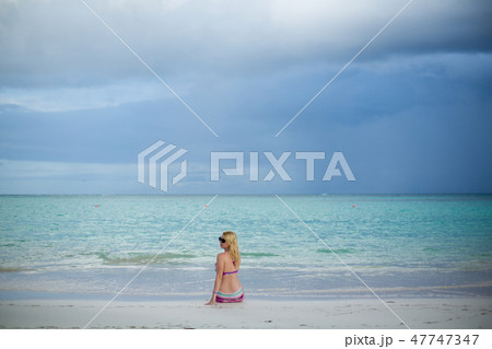 Young sexy blonde woman in bikini near sea 47747347