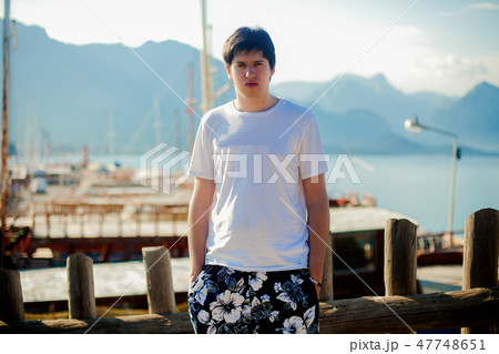 Young man near sea at vacation 47748651