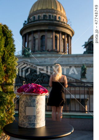 Young sexy blonde woman with bouquet of flowers 47748749