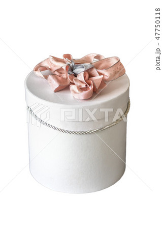 Gift box Tied with a pink ribbon close up on a white background. Gift box Tied with a pink ribbon close up on a white background. 47750118