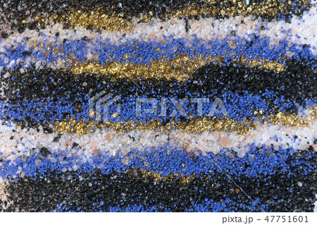 Layered colorful sand pattern. Marble style background. Blue and gold powder texture. Layered colorful sand pattern. Marble style background. Blue and gold powder texture. 47751601