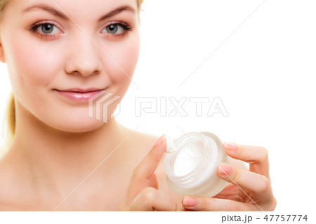 Skin care. Girl applying moisturizing cream Skin care. Girl applying moisturizing cream 47757774