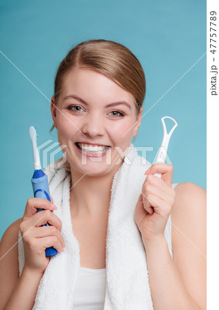 Girl with brush and tongue cleaner. 47757789