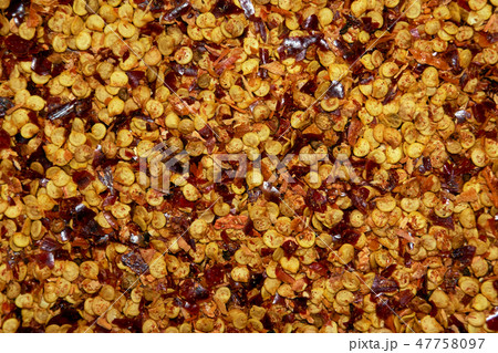 Dried chili flakes and seeds 47758097