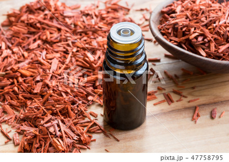 A bottle of red sandalwood essential oil A bottle of red sandalwood essential oil 47758795