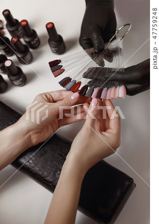 Master of manicure in black gloves Master of manicure in black gloves 47759248
