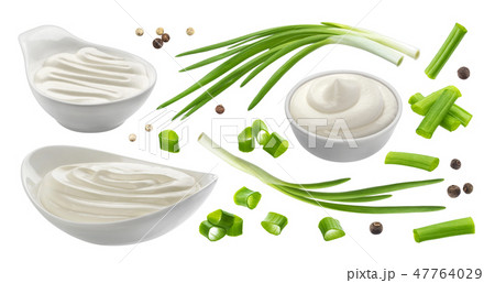 Sour cream and chives isolated on white background, green onion with sour cream sauce 47764029
