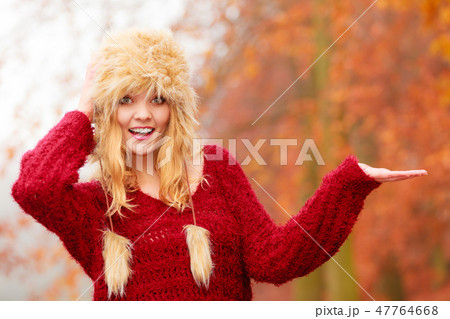 Pretty smiling woman in fur hat with copy space. Pretty smiling woman in fur hat with copy space. 47764668