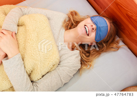 Sleeping woman wearing blindfold sleep mask. 47764783