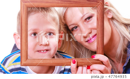 Mother and son play with empty frame. 47764935