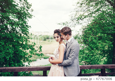 loving wedding couple embracing 47767006