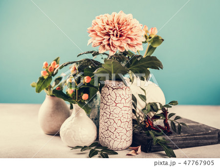 Vase with beautiful chrysanthemum flowers on light table Vase with beautiful chrysanthemum flowers on light table 47767905