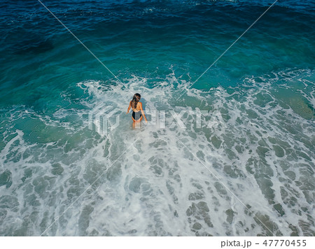 Aerial top view young woman on the sand beach Aerial top view young woman on the sand beach 47770455