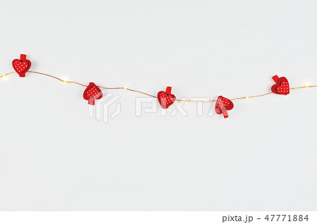 Minimalist composition with fairylight and hearts 47771884