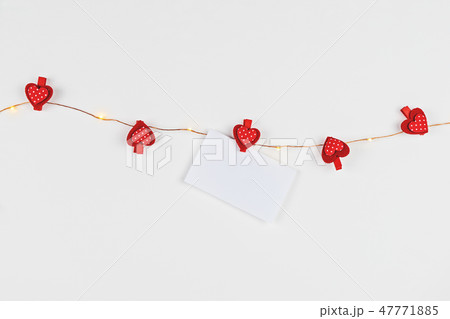 Minimalist composition with fairylight and hearts 47771885