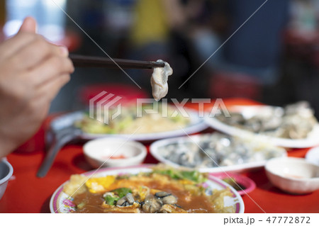 Oyster Omelet and chopsticks  .taiwanese food 47772872