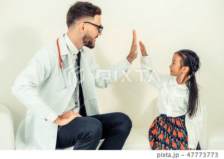 Happy little kid visit doctor in hospital office. 47773773