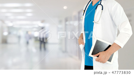 Doctor using tablet computer at the hospital. Doctor using tablet computer at the hospital. 47773830