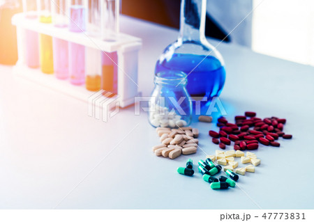 Medicine pills and tablets in research lab. Medicine pills and tablets in research lab. 47773831