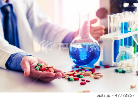 Medicine pills and tablets in research lab. 47773857