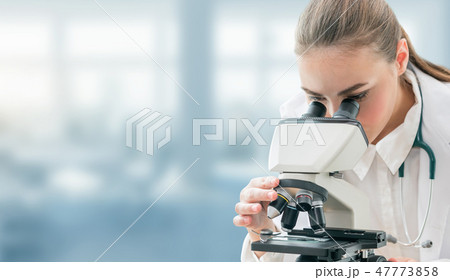 Scientist researcher uses microscope in laboratory 47773858