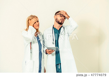 Two upset doctors. A medical failure concept. Two upset doctors. A medical failure concept. 47774079