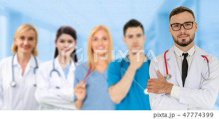 Doctor working in hospital with other doctors. 47774399