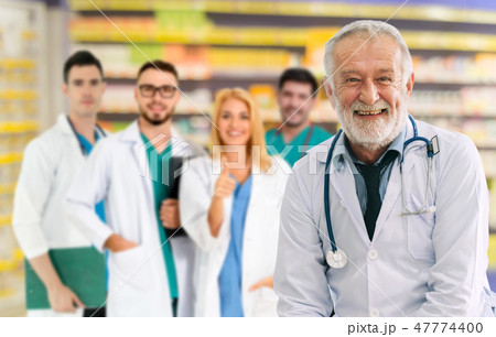 Doctor working in hospital with other doctors. Doctor working in hospital with other doctors. 47774400