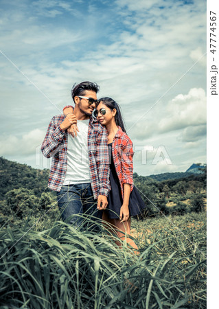 Happy couple take a romantic walk on the hills. Happy couple take a romantic walk on the hills. 47774567