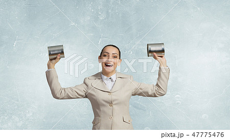 Woman using deaf phone 47775476