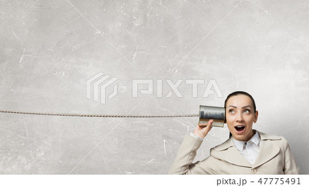 Woman using deaf phone 47775491