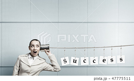 Woman using deaf phone 47775511