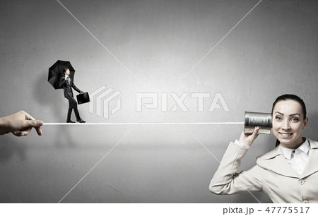 Woman using deaf phone 47775517